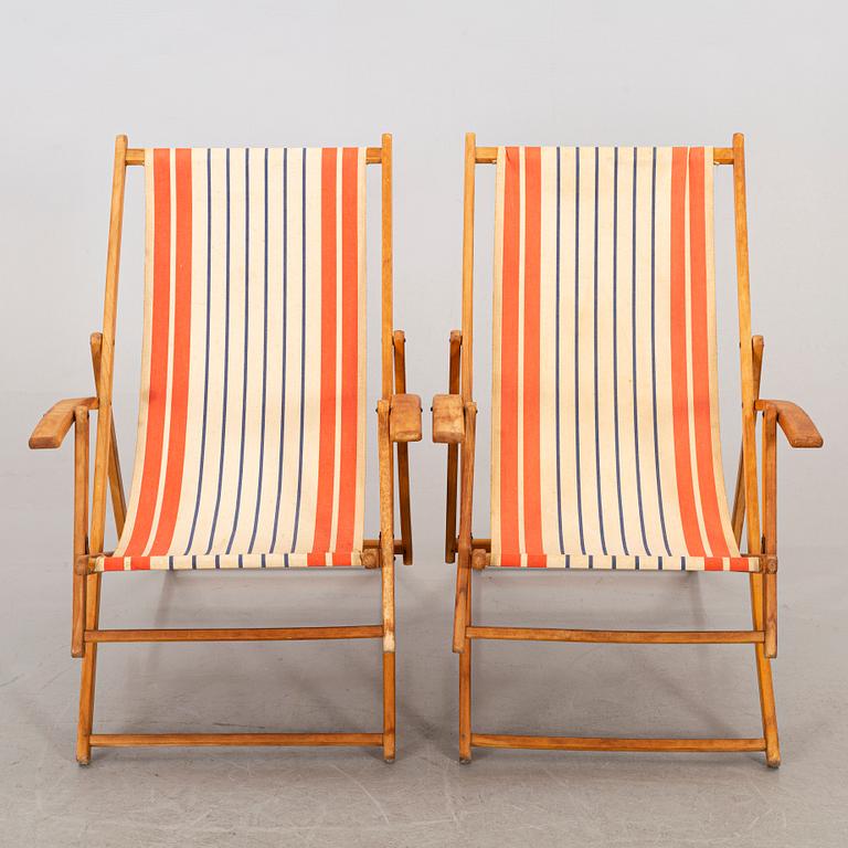 A pair of mid 20th century beach chairs.