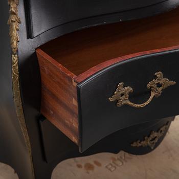 A mid 20th Century rococo style chest of drawers.