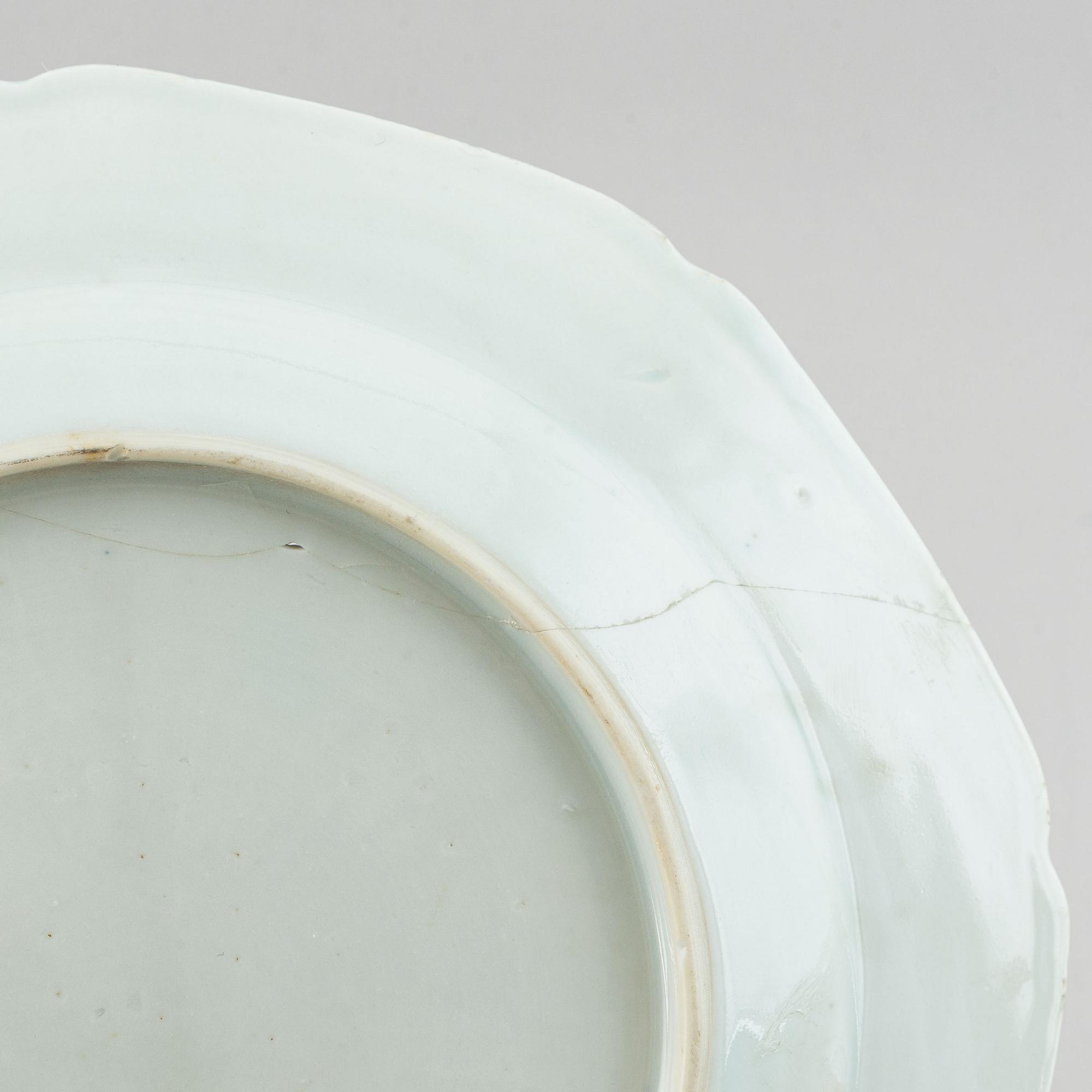 Eight blue and white export porcelain plates, Qing dynasty, Qianlong (1736-95).