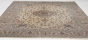 A semi-antique silk Keshan carpet, c. 350 x 248 cm.
