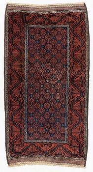 A semi-antique rug, baluch, including flat weave ca. 216 x 110 cm.