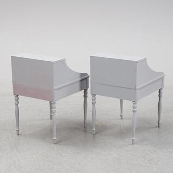 A pair of 20th Century bedside tables.