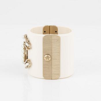 Chanel, a white acrylic bracelet with pearls, 2019.