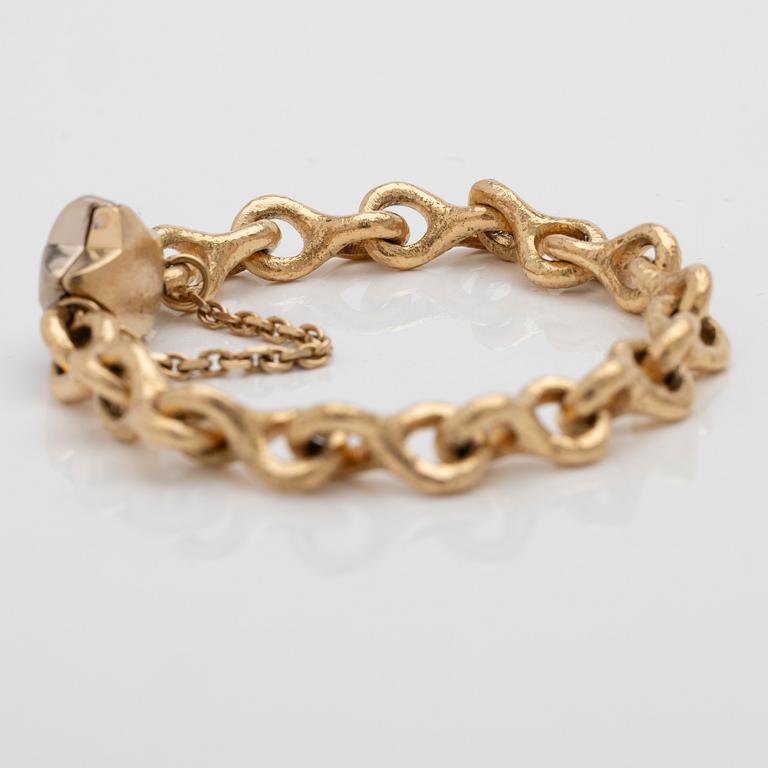 Armband 18K guld med en diamant.