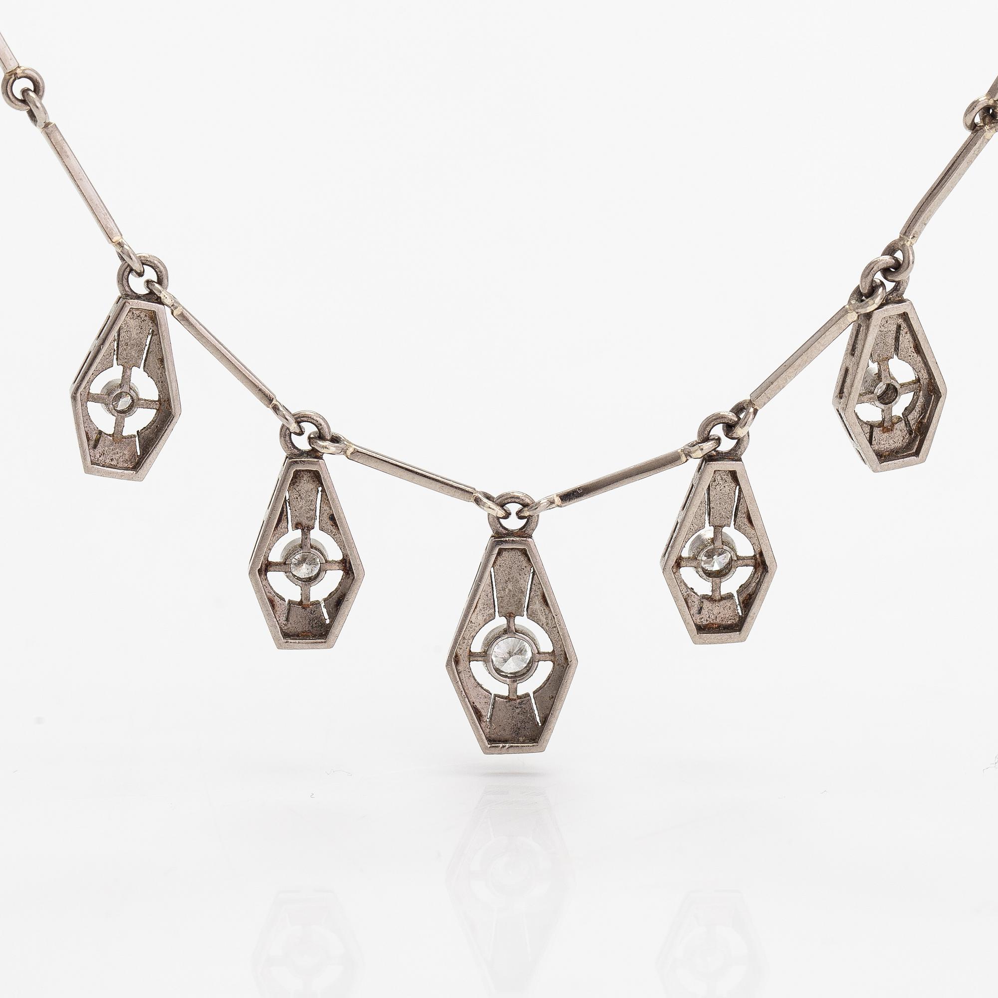 A necklace, ring and earrings, 14K gold and diamonds ca. 0.92 ct in total. Westerback, Helsinki 1964-1973.