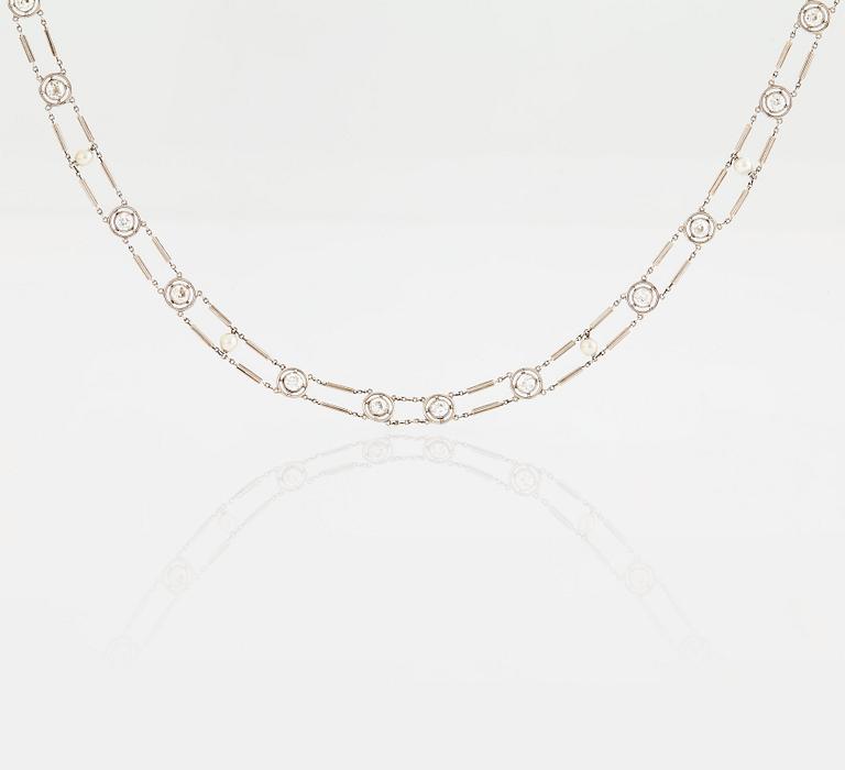 A NECKLACE with round brilliant-cut diamonds and pearls.