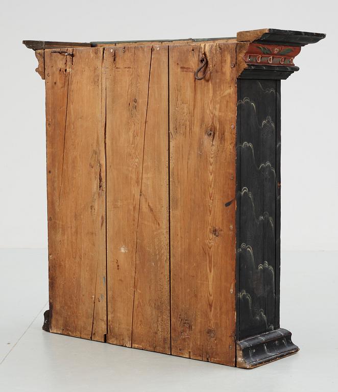A Swedish wall cabinet, dated 1820.