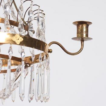 A late Gustavian four-light chandelier, early 19th century.