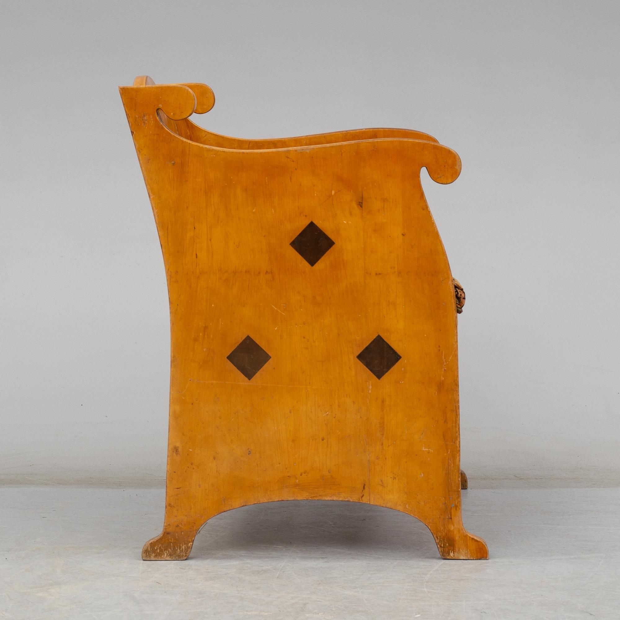 An early 20th century birch armchair.