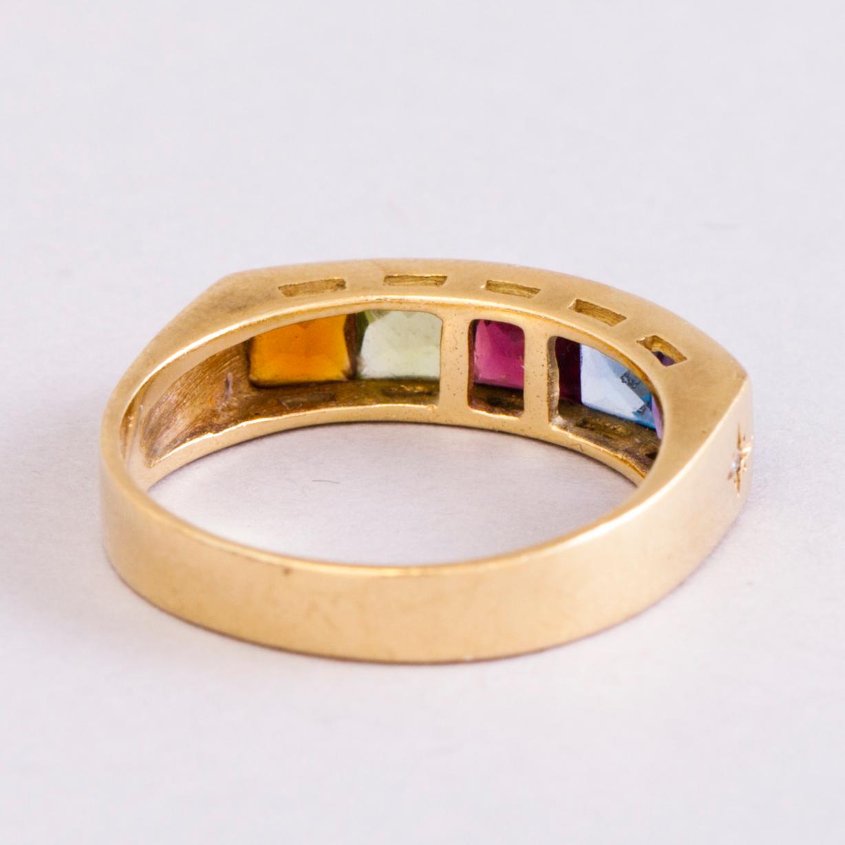 A 18K gold ring with 5 different stones: citrine, amethyst, topaz, garnet, peridot and a small diamond. Probably H.Stern.