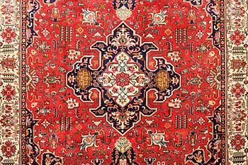 A Tabriz carpet, c. 335 x 257 cm.
