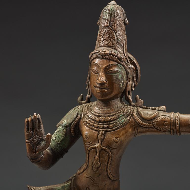 A bronze scupture of Krishna who has konkured the five headed serpant, India, early 20th Century.