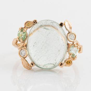 Green tourmaline, yellow sapphire and brilliant cut diamond ring.
