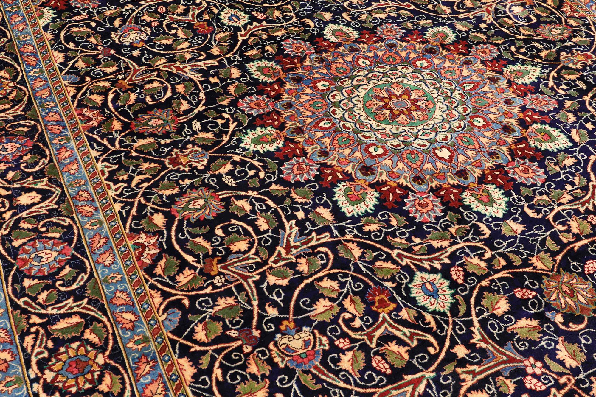 A carpet, Kashmar, signed, ca 390 x 295 cm.