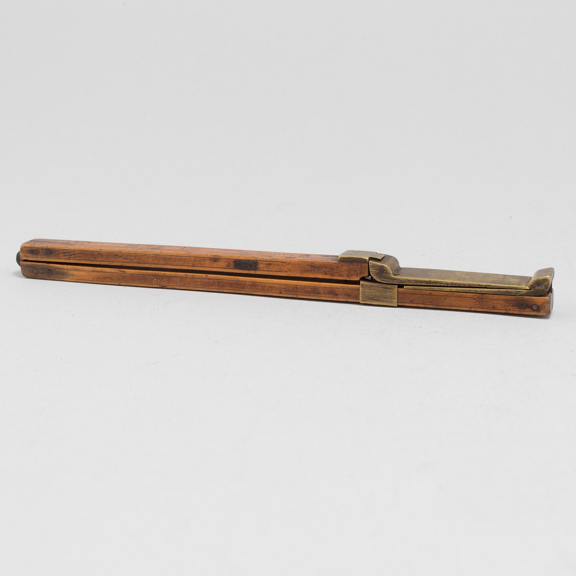 A 19th century wooden measuring stick.