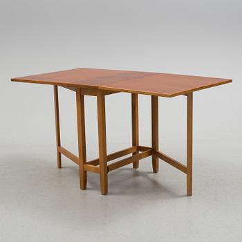 A mid 20th century flap table.