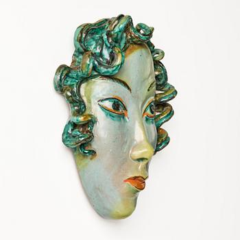 Allan Ebeling, a glazed earthenware wall sculpture of a masque, Torshälla 1934.