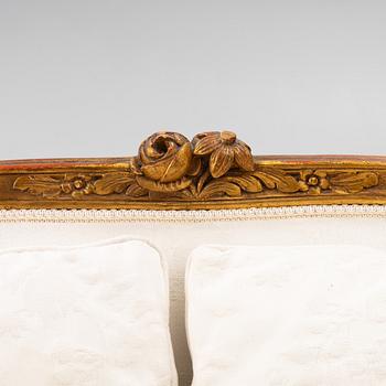 A Louis XV-style sofa, early 20th century.