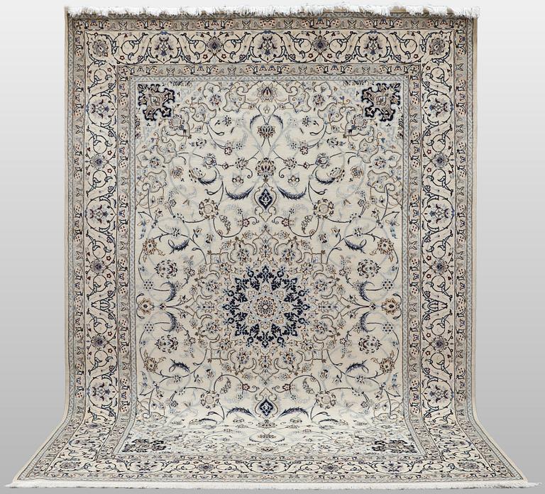A Nain carpet, part silk, so-called 9 LAA, approx. 355 x 248 cm.