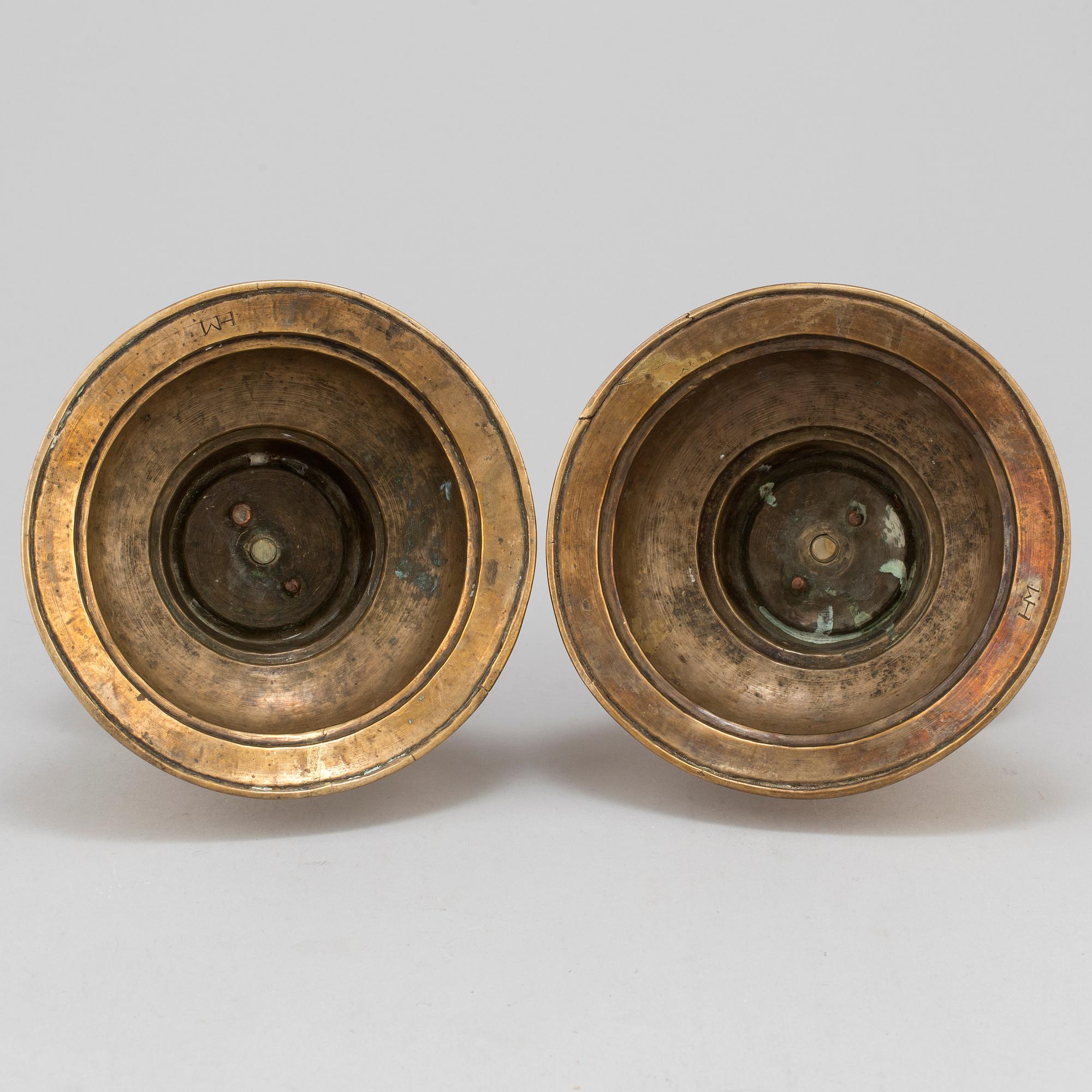 A pair of 17th century brass candlesticks.