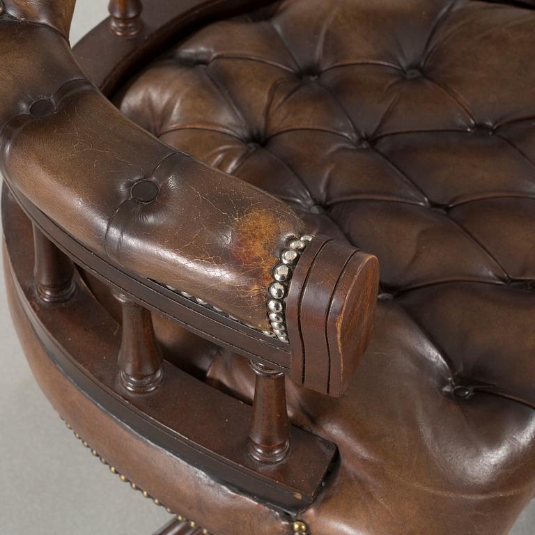 A desk chair in English style, made in the second half of the 20th century.