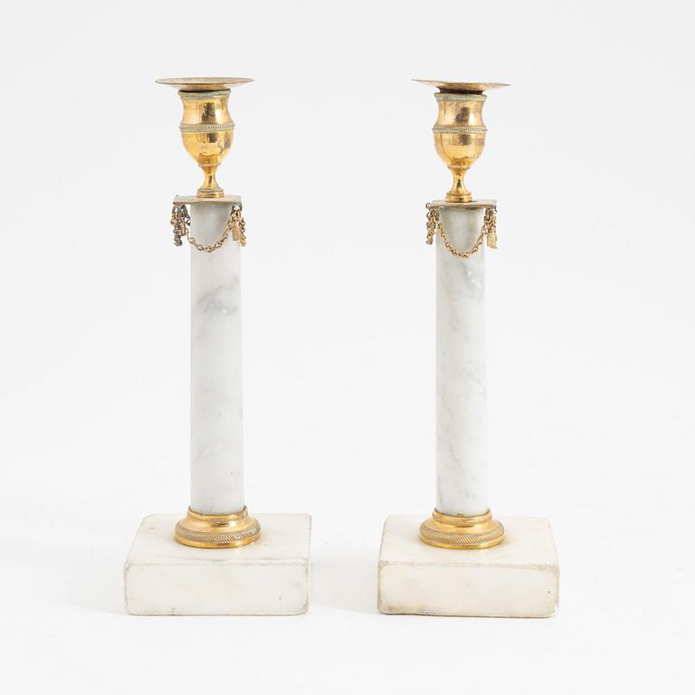 A pair of late Gustavian marble candlesticks, early 19th Century.