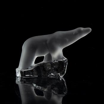 Nine glass polar bears.