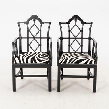 A pair of modern Eichholtz armchairs.