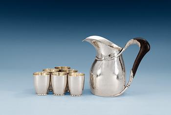 1102. An Evald Nielsen pitcher and 6 mugs, Copenhagen 1920.