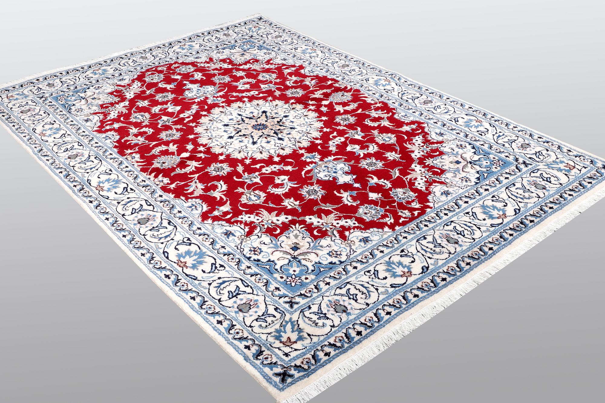 A carpet, Nain, part silk, ca 238 x 170 cm.