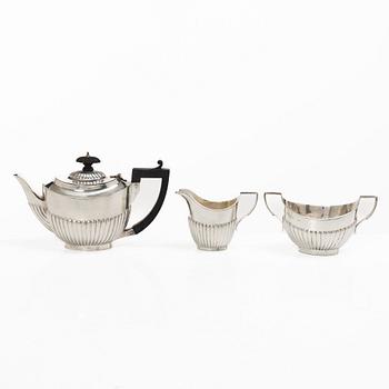 Thomas Hayes, a silver teapot, cream jug and sugar bowl, Birmingham 1897.