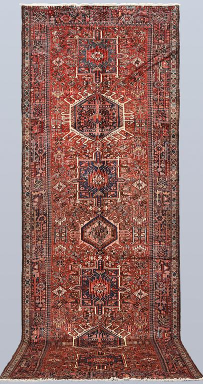 A semi-antique Garadje runner, approx. 425 x 148 cm.