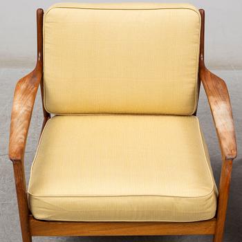 A pair of USA-75 easy chairs by Folke Ohlsson, DUX.