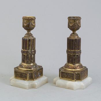 A PAIR OF BRASS AND ALABASTER GUSTAVIAN STYLE CANDLESTICKS, 19th century.