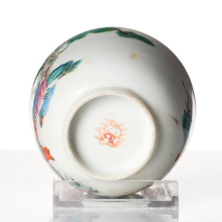 A famille rose 'trick cup' with a little figure, Qing dynasty, 19th Century.