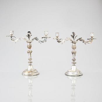 A pair of Swedish Rococo argent haché candelabra.