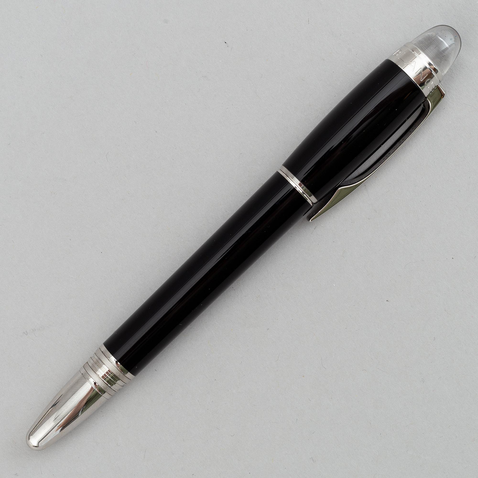 MOntblanc, a ball point pen and leather passport holder.