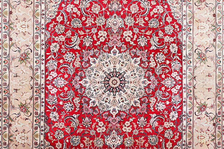 An Esfahan carpet with silk warp, c. 298 x 206 cm.