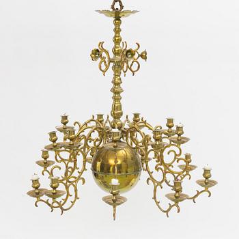 A baroque-style eighteen-branch brass chandelier, late 19th century.