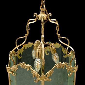 A brass ceiling light "Jubileumslyktan" by K.A. Jonsson, signed and dated 2002.
