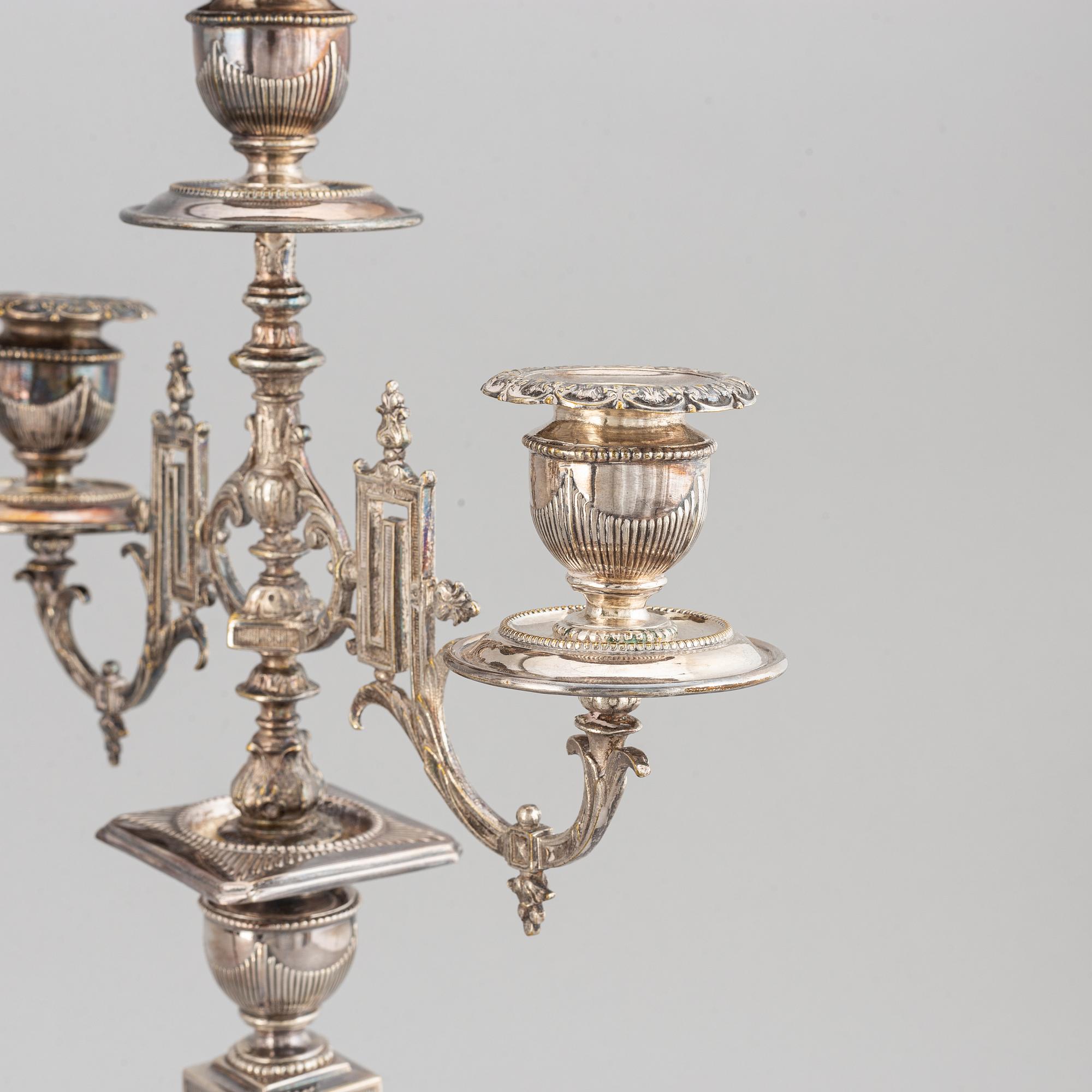 A pair of silver plated candelabras, early 20th century.