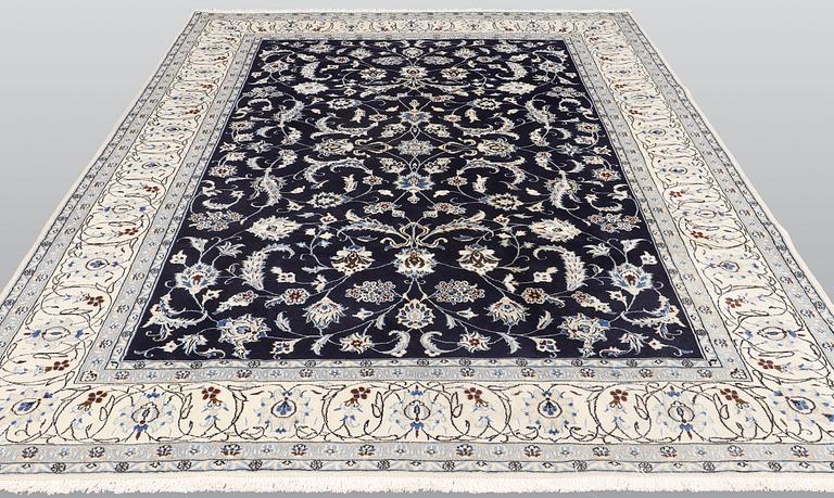A carpet, Nain, part silk, ca 350 x 247 cm.
