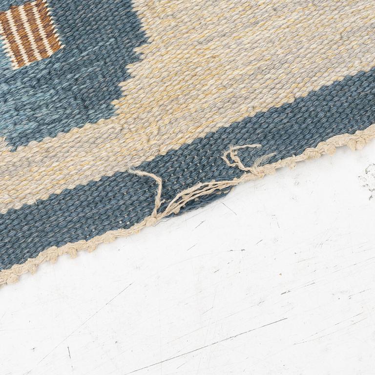 A flat weave carpet by Anna-Greta Sjöqvist c 223 x 144 cm, signed AGS.