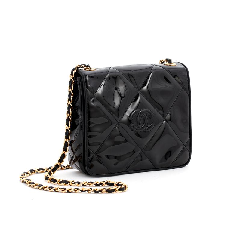 CHANEL, a black patent leather shoulder back.