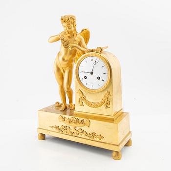 A French Empire ormolu figural mantel clock, early 19th century.