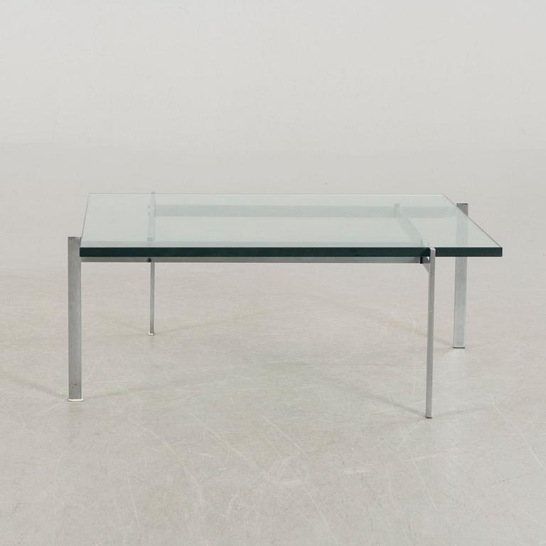 A Poul Kjaerholm PK61 glass table by Fritz Hansen.