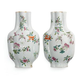 1129. A pair of famille rose 'floral' wall vases, Qing dynasty, 19th century.