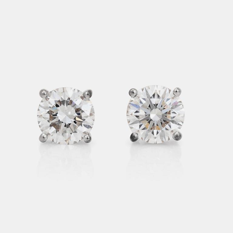 A pair of brillian-cut diamond earrings. Total carat weight of diamonds 2.01ct.