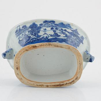 A blue and white tureen with cover, a plate and a butter tureen with cover and stand, China, 18th and 19th century.