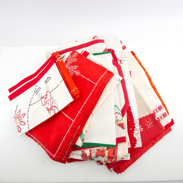 A collection of smaller Christmas tablecloths, runners, wall hangings, curtains, and Christmas tree skirts, 32 pcs, 20th century.